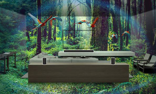 Composite image of a living room with sofa and surround sound system within a lush jungle setting.